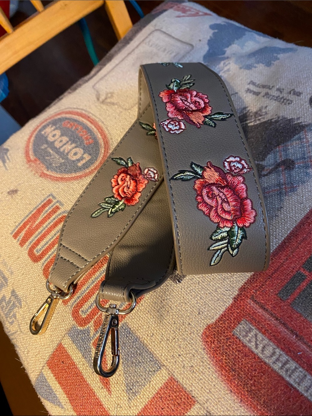 Grey color with roses gold tone hardware 40” wide 2” strap for bag